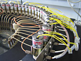 View onto the reagent valves of an ABI 3900HT DNA / RNA synthesizer with turn around valve option for easy exchange of broken valves and to prevent electrical short cuts of leaking valves.